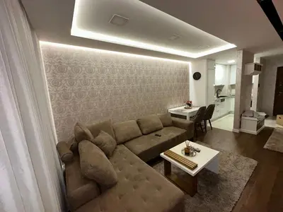 a living room with a couch and a table at Apartman Gak 2 in Banja Luka