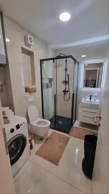a bathroom with a shower and a toilet and a sink at Apartman Gak 2 in Banja Luka