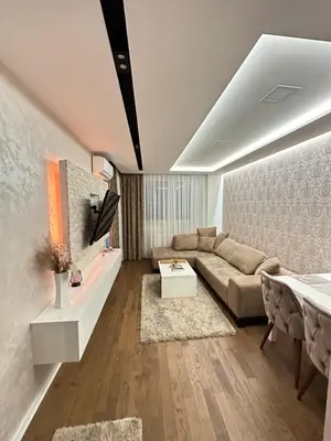 a living room with a couch and a table at Apartman Gak 2 in Banja Luka