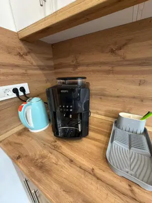 a coffee maker on a counter in a kitchen at Apartman Hendek Tuzla in Tuzla