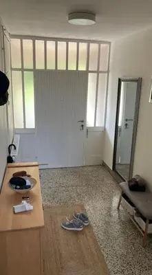 a living room with a table and a mirror at Large Modern House in Prijedor Bosnia Three Bedrooms Two Full Bathrooms Close to Zagreb EU Border Banja Luka Perfect for Bikers and Families in Prijedor