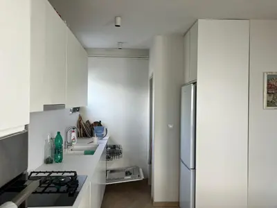 a kitchen with white cabinets and a refrigerator at Large Modern House in Prijedor Bosnia Three Bedrooms Two Full Bathrooms Close to Zagreb EU Border Banja Luka Perfect for Bikers and Families in Prijedor