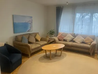 a living room with a couch and a table at Large Modern House in Prijedor Bosnia Three Bedrooms Two Full Bathrooms Close to Zagreb EU Border Banja Luka Perfect for Bikers and Families in Prijedor