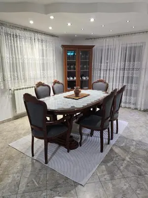 a dining room with a table and chairs at Teo FAMILY APARTMENT TUZLA in Tuzla