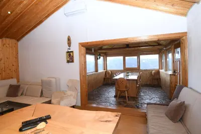 a living room with a couch and a table at Vikendica Ivanović in Banja Luka