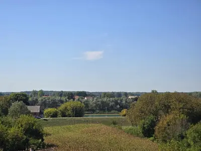 a view of a field with trees and a road at Splendida in Bosanska Gradiška