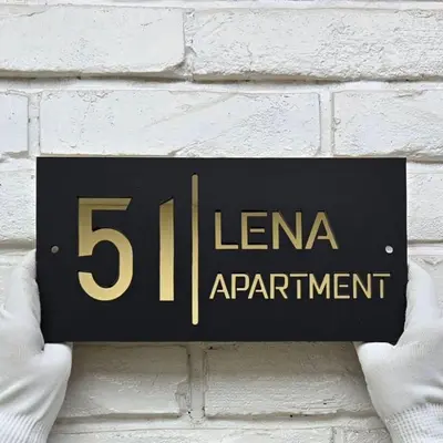 a sign on a wall that reads elena apartment at Apartman Lena 51 BL in Železnička Stanica Incel