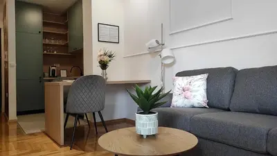 a living room with a couch and a table at Apartman Lena 51 BL in Železnička Stanica Incel