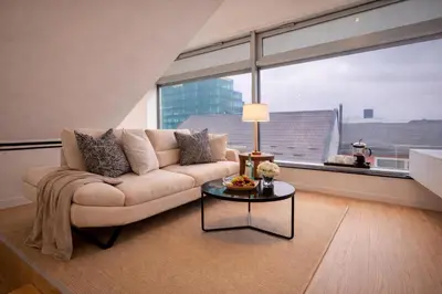 a living room with a couch and a table at BERLINA RESIDENCE Luxury Apartment in Bihać