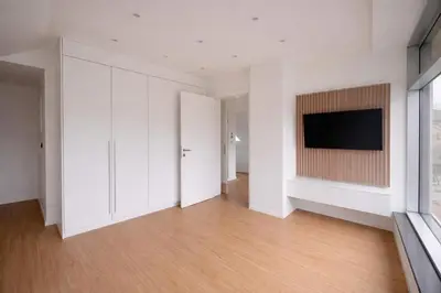 a living room with a flat screen tv on a wall at BERLINA RESIDENCE Luxury Apartment in Bihać