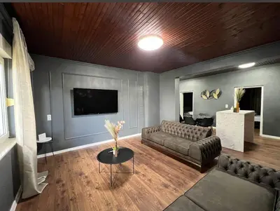 a living room with a couch and a tv at Villa Luxury Crystal center in Bihać