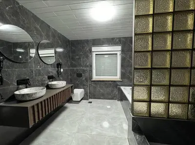 a bathroom with two sinks and a tub at Villa Luxury Crystal center in Bihać