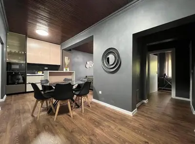 a kitchen and dining room with a table and chairs at Villa Luxury Crystal center in Bihać