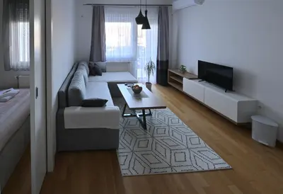 a living room with a couch and a table at Apartman Nika in Banja Luka