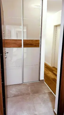 a sliding glass door in a room at Premium Skver Tuzla - City Center in Tuzla