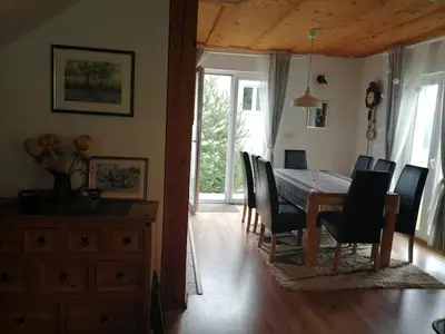a dining room with a table and chairs at Holiday Home Slavica in Kupres