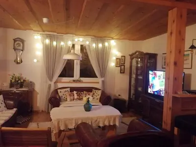 a bedroom with a bed and a television in it at Holiday Home Slavica in Kupres