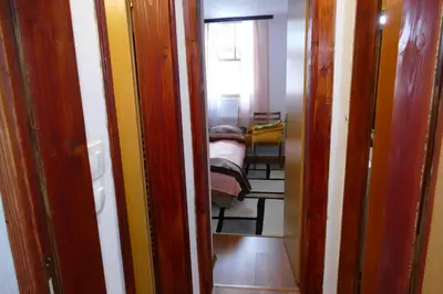 a small room with a bedroom with a bed in it at Vlašić House in Vlasic