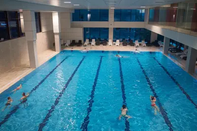 a group of people in a swimming pool at Hotel Mellain in Tuzla