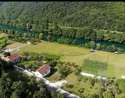 an aerial view of a house next to a river at Home-Vasva and Hazim in Ćukovi