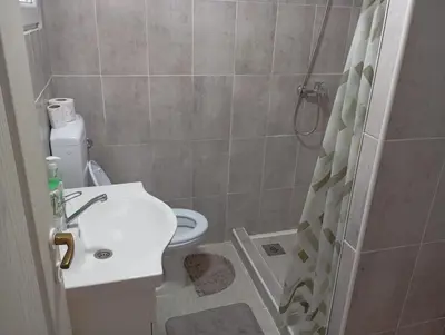 a bathroom with a toilet and a sink and a shower at Home-Vasva and Hazim in Ćukovi