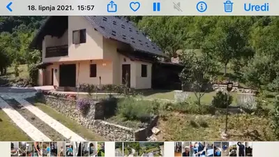 a picture of a house with people standing in front of it at Holiday Home Ajaz Bihac in Bihać