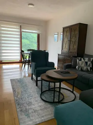 a living room with a couch and a table at Holiday Home Ajaz Bihac in Bihać