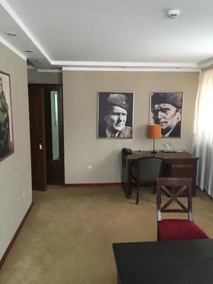 a room with a desk and pictures on the wall at Hotel Stari grad in Jajce