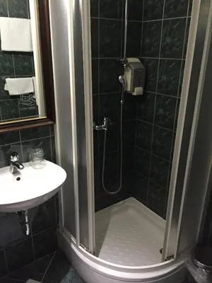 a bathroom with a shower and a sink at Hotel Stari grad in Jajce