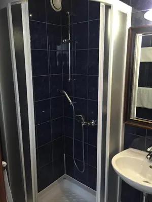 a bathroom with a shower and a sink at Hotel Stari grad in Jajce