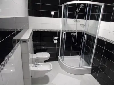 a bathroom with a shower and a toilet and a sink at Motel Kamenica in Bihać