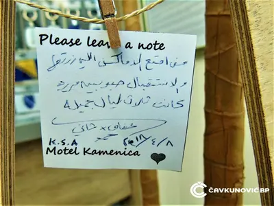 a sign attached to a mirror with writing on it at Motel Kamenica in Bihać