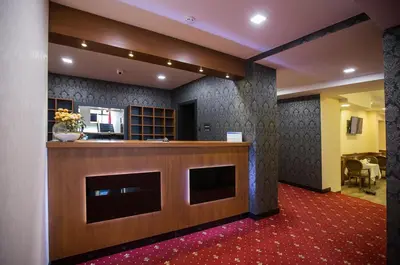 a lobby with a reception desk in a building at Hotel Exclusive President in Morančani
