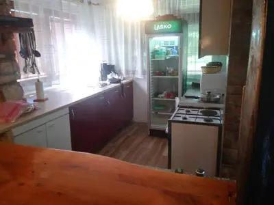 a kitchen with an open refrigerator and a stove at Ribarska Vila in Donje Lohovo