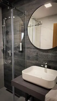 a bathroom with a sink and a mirror at Hotel Brcko Gas Prijedor in Prijedor