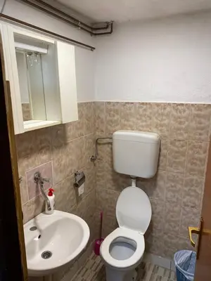 a bathroom with a toilet and a sink at Lav Apartments in Bihać