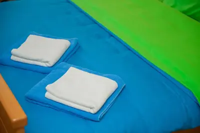 two white pillows sitting on a play bed at Prenoćište 