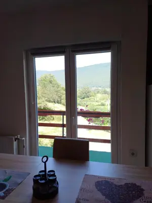 a room with a large window with a view at Apartman Denis Una in Lužine