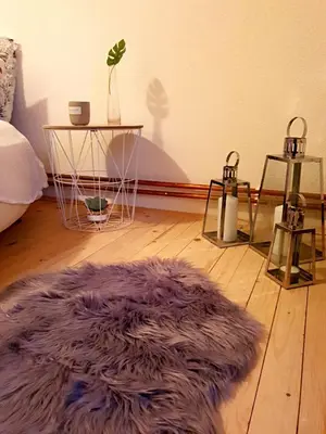 a room with a purple rug on a wooden floor at Vikend Kuća Iman in Vlasic