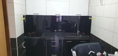a small kitchen with a sink and a mirror at Apartment Savanovic in Banja Luka
