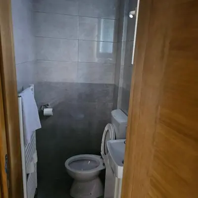 a small bathroom with a toilet and a sink at Apartment Savanovic in Banja Luka