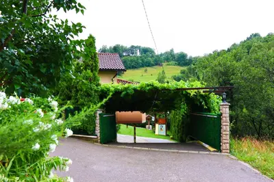 a garden with a gate with ivy on it at Holiday Home Pharaoh in Visoko