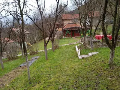 a house on a hill with trees in front of it at Holiday Home Pharaoh in Visoko