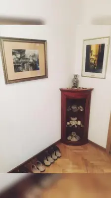 a corner of a room with a shelf of shoes at Apartments Konak in Visoko