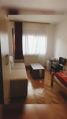 a living room with a couch and a table at Apartments Konak in Visoko