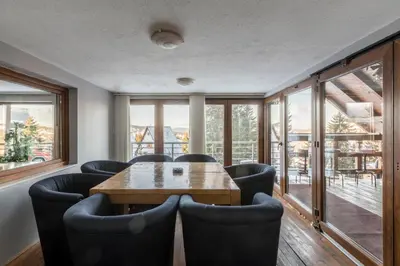 a conference room with a wooden table and chairs at Vlasic Nanna & Lalla in Vlasic