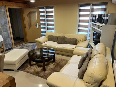 a living room with a couch and a table at Vlasic Nanna & Lalla in Vlasic