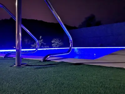 a blue light on a bench at night at Villa Meli in Visoko