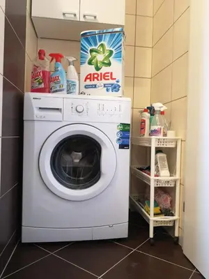 a washing machine with a box on top of it at Villa Meli in Visoko
