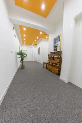 an empty hallway with white walls and a ceiling at Hotel Rekic in Bihać